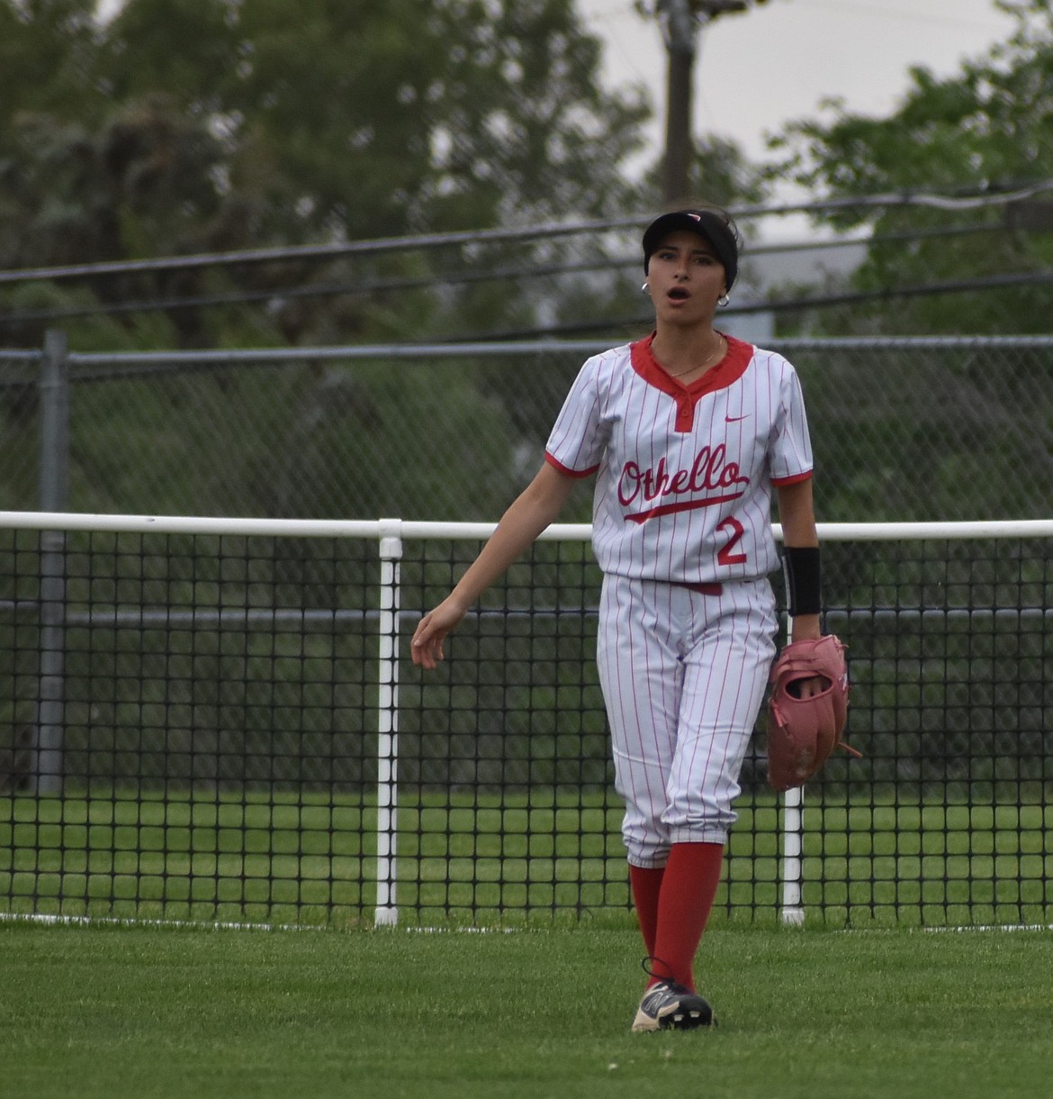 Evony Gomez from Othello calls to her team from the outfield in a prior home game this season.
