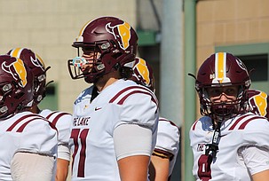 Jeremiah Baker (71) prepares to run out to the field with his teammates. Baker signed to Pacific Northwest Christian College in April, after a long journey to becoming a starter at Moses Lake High School.