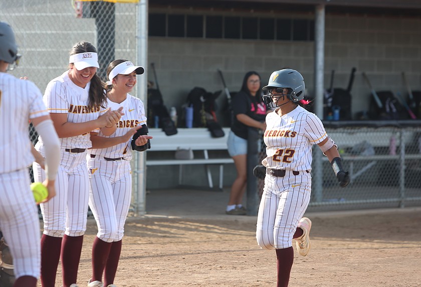 Mya Martinez (22) is all smiles being greeted by her team after hitting a home run against Sunnyside Tuesday. Moses Lake defeated the Grizzlies 16-0.