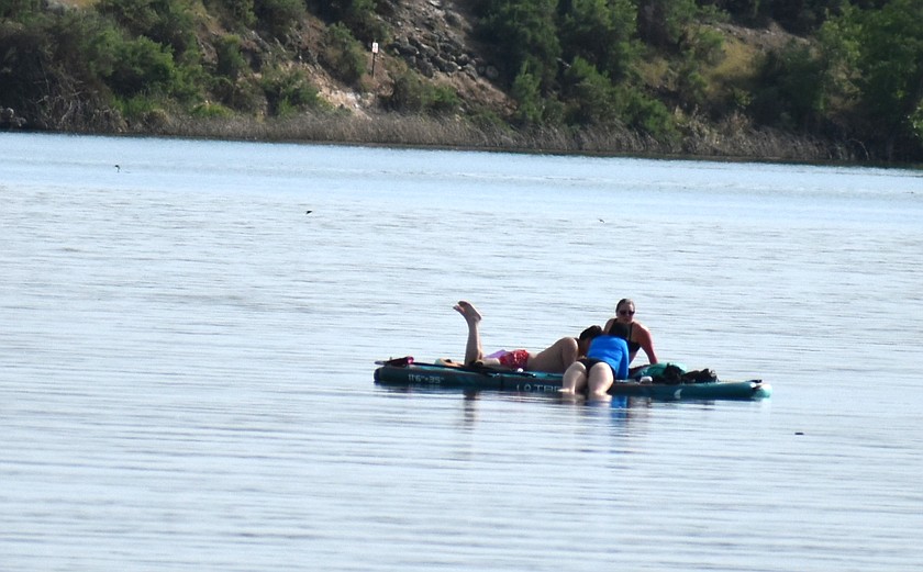 Some folks spend a warm afternoon floating on Moses Lake.