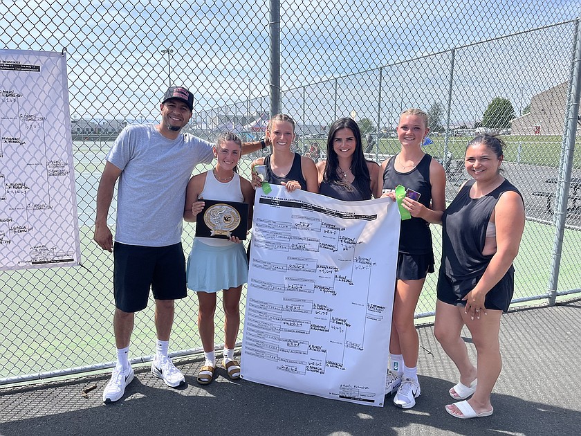 Othello’s Boys Coach Caleb Tovar, Olivia Harris, Faith Risenmay, Girls Coach Priscilla Tovar, Shaylee Freeman and JV Coach Yanitta Coleman celebrate the team becoming District 5 Champions.