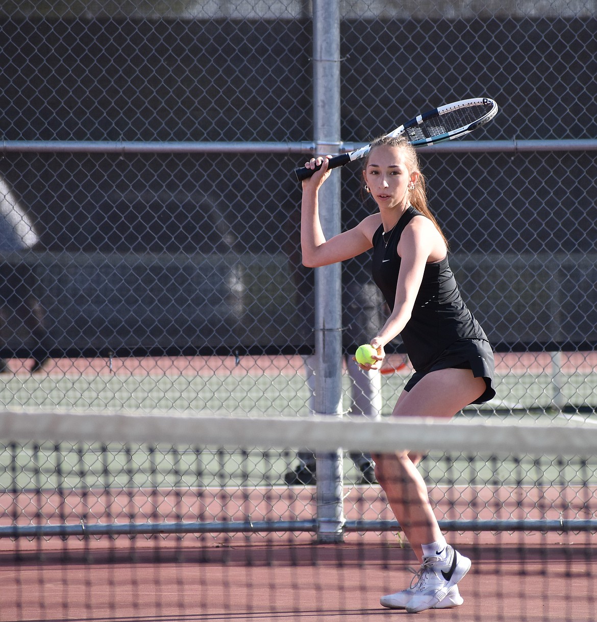 Meila Zuidema from the Huskies gets ready to serve the ball in a matchup earlier in the season.