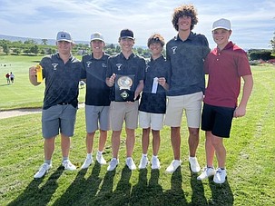 The Moses Lake Mavericks gather for a team photo after earning co-league champion honors and the district title.