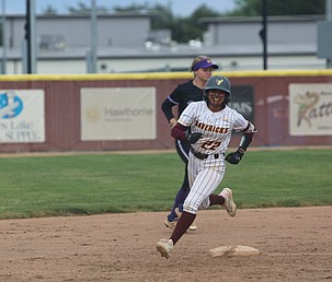 Mya Martinez (22) is all smiles as she rounds second base after hitting another home run. Her three homers and nine RBIs helped the Moses Lake Mavericks defeat Wenatchee 24-4.