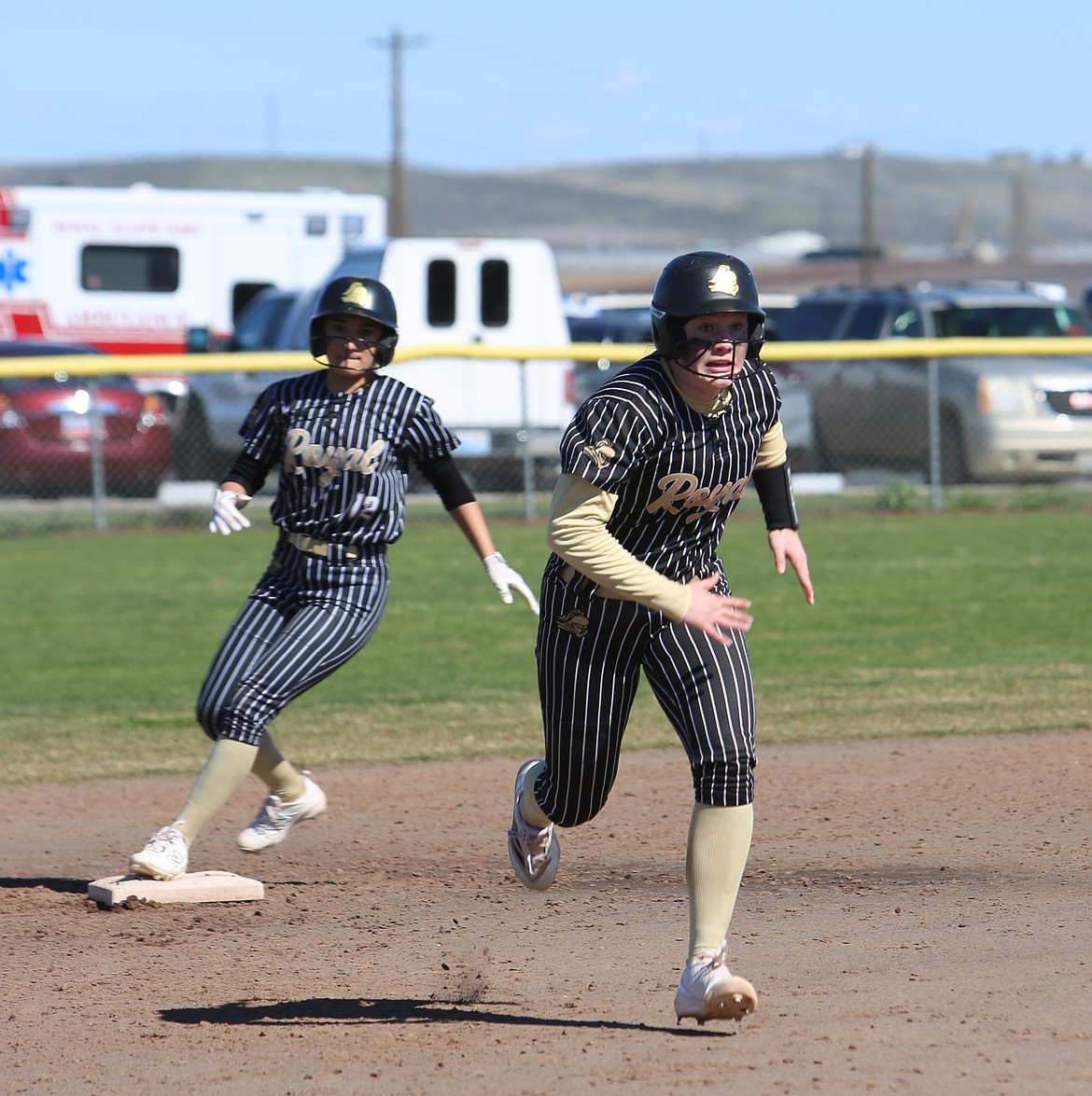 Lizzie Jenks (13) sprints toward third base during their game against Zillah.