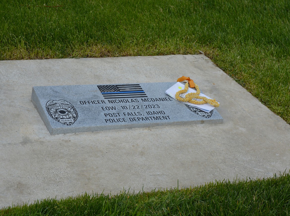 A memorial stone remembering Officer Nicholas McDaniel is now present at 5th Avenue in Post Falls, near Idaho Road.