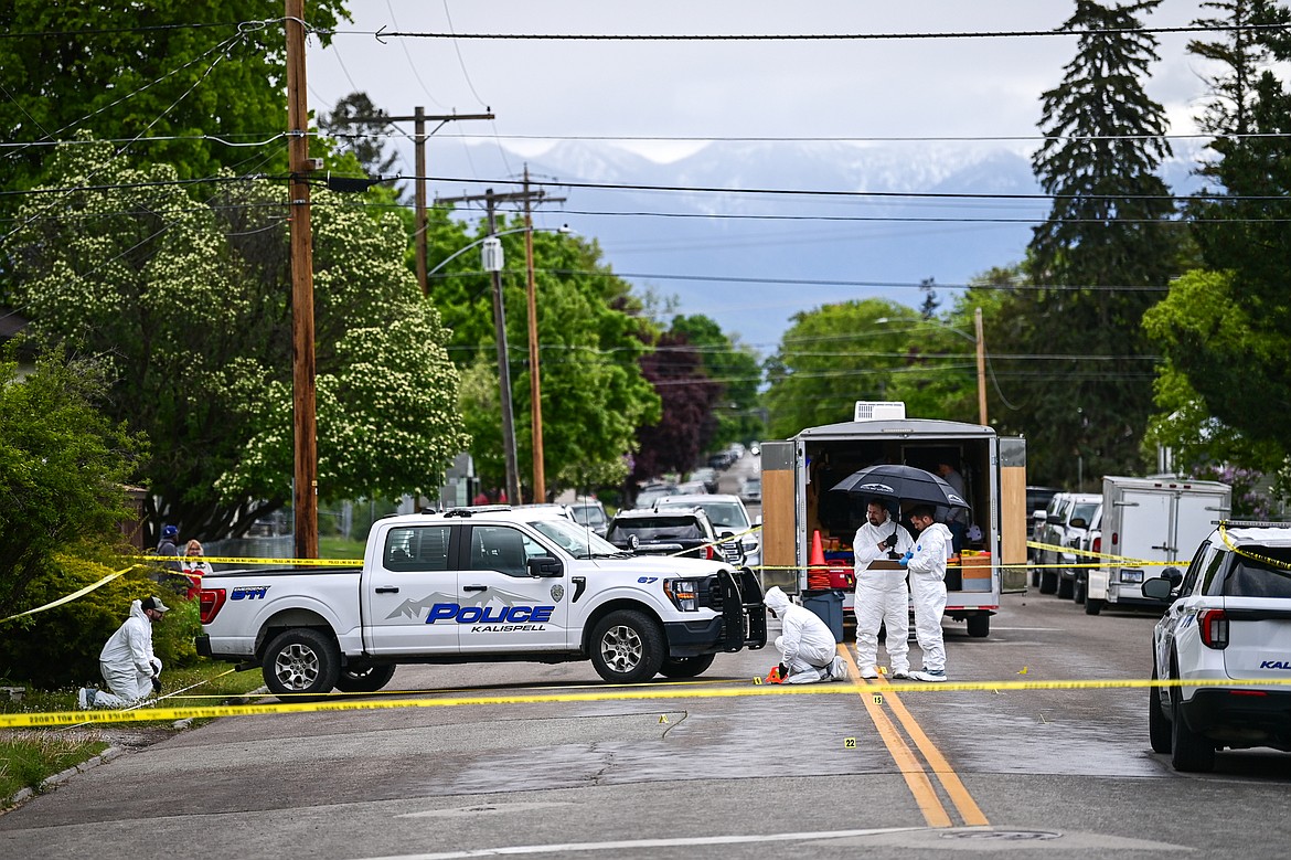 Kalispell police and other law enforcement personnel conduct a death investigation along Second Street West at 10th Avenue West in Kalispell on Saturday, May 16. (Casey Kreider/Daily Inter Lake)