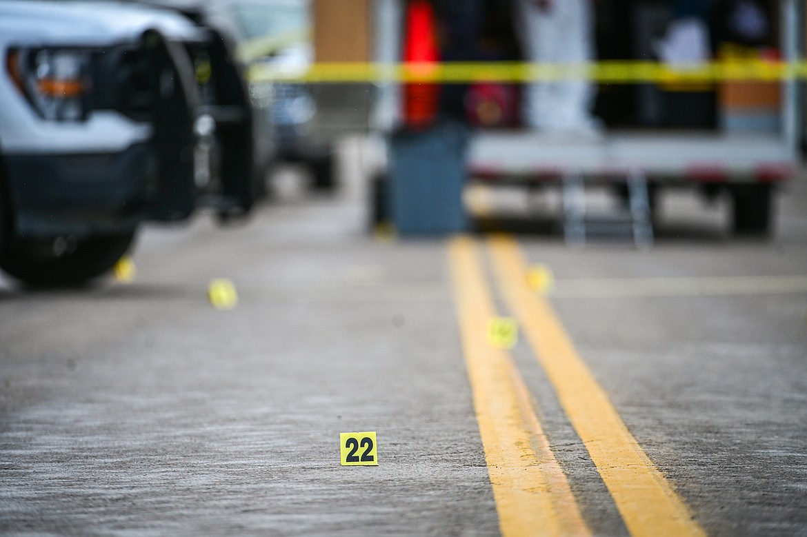 Evidence markers are placed along the street at a death investigation along Second Street West at 10th Avenue West in Kalispell on Saturday, May 16. (Casey Kreider/Daily Inter Lake)
