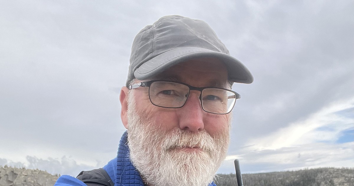 Outstanding in his field, out hiking in the mountains