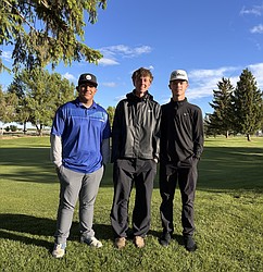 Jaden Hernandez, JJ Madsen and Everett Cox stand together for a photo at Colockum Ridge Golf Course. The three Cougars qualified for the 2B State Tournament.