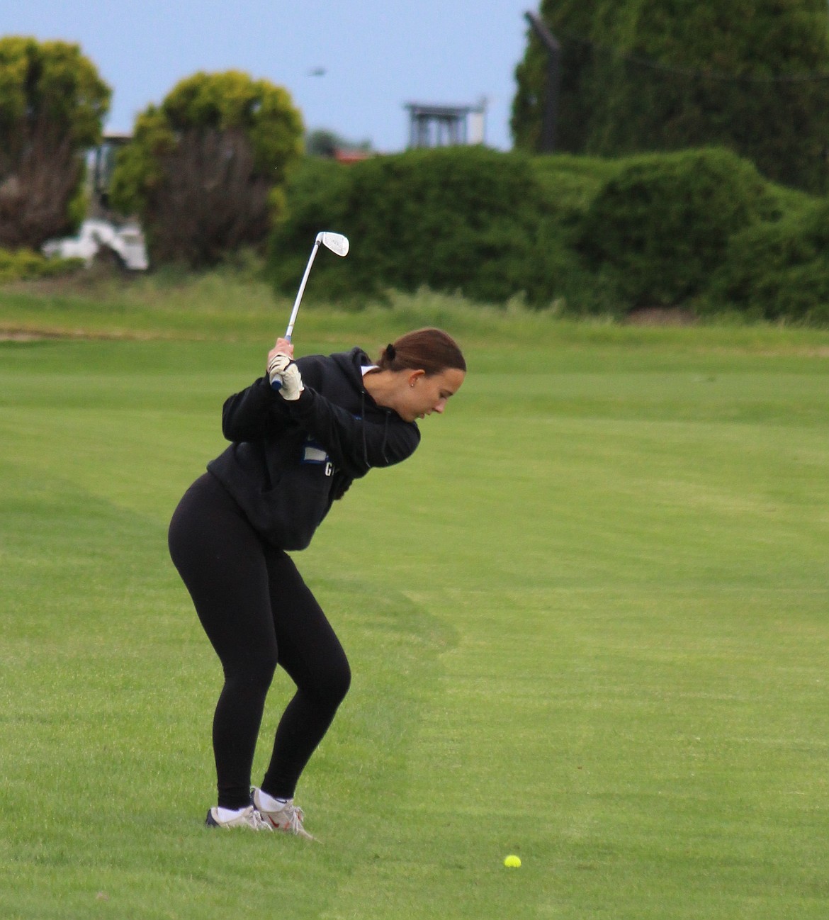 Amaya Erickson, a senior from the Cougars prepares to swing at the ball as she competes at Colockum Ridge.