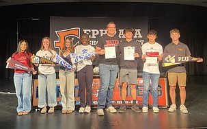 From left: Alexa Bastida, Lila Rainey, Stella Bayley, Delanie Killinger, Michael Park, Alex Belino, Hunter Mills and Caleb Moberg at the Ephrata Tigers signing day Friday.