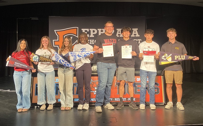 From left: Alexa Bastida, Lila Rainey, Stella Bayley, Delanie Killinger, Michael Park, Alex Belino, Hunter Mills and Caleb Moberg at the Ephrata Tigers signing day Friday.