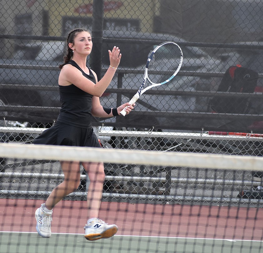 Huskies senior Olivia Harris gets ready to respond to a hit from her opponent in an earlier matchup this season. Harris and the Othello doubles team of Shaylee Freeman and Faith Risenmay are heading to the state tournament in Seattle this weekend.