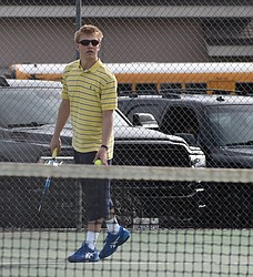 Royal tennis player Cael Orth gets ready to play in a home match earlier in the season. Orth claimed a spot in the state tournament after a successful bout in the district tournament.