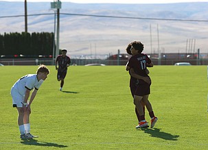 Icker Lopez (17) celebrates with Ethan Moreno (10) after scoring a goal against Eastside Prep in the 1A state tournament. The Wahluke Warriors won 2-0 Tuesday, advancing to the second round.