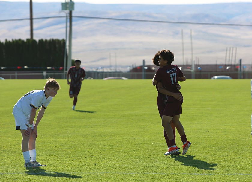 Icker Lopez (17) celebrates with Ethan Moreno (10) after scoring a goal against Eastside Prep in the 1A state tournament. The Wahluke Warriors won 2-0 Tuesday, advancing to the second round.