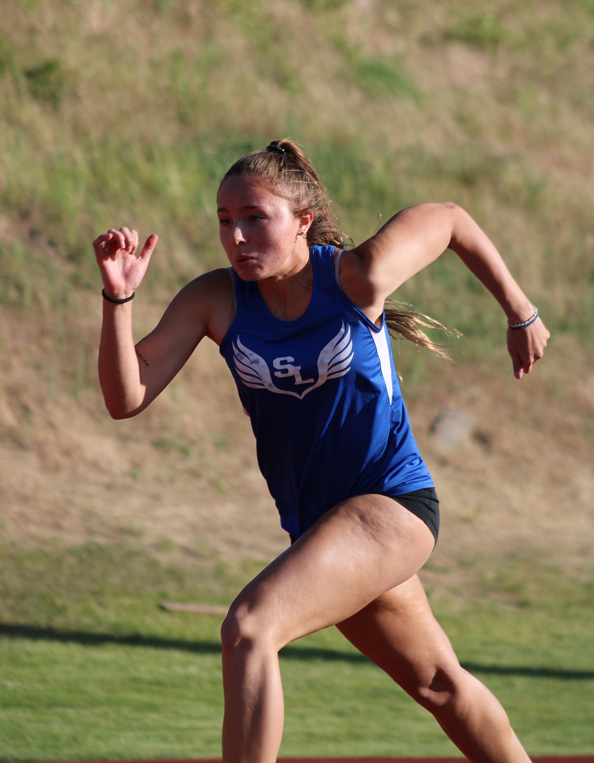 Soap Lake’s Sage Hart sprints down the track during the district competition Tuesday.