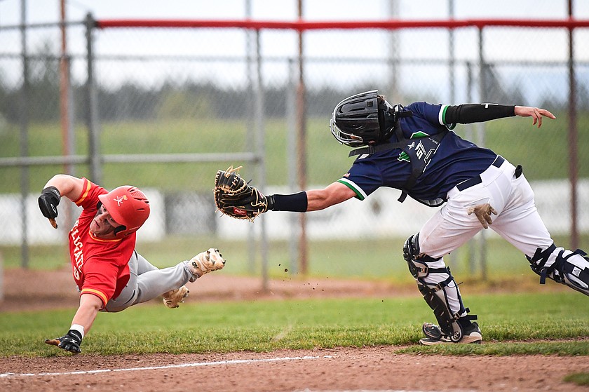 Glacier catcher Brady Buckmaster (18) tags out Missoula Hellgate's Owen Felton (9) on a throw from center fielder Teagan Dixon to preserve a 7-6 lead in the seventh inning at Griffin Field on Friday, May 22. (Casey Kreider/Daily Inter Lake)