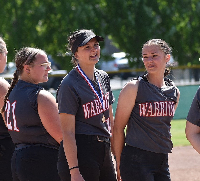 Peyton Roberts (15) from the Warriors stands between her teammates Grace Erickson (21) and Lainee Baergen (7) after Friday’s game against Colton. Roberts earned the sportsmanship award.