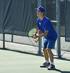 Xavier Ewing from the Eagles gets ready for his opponent to serve the ball during the 1B State Tennis tournament Friday morning.