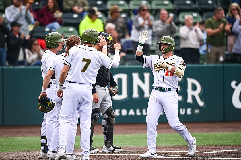 Glacier's Logan Beard (29) celebrates with teammates after his three-run home run in the second inning against Great Falls at Glacier Bank Park on Tuesday, May 26. (Casey Kreider/Daily Inter Lake)