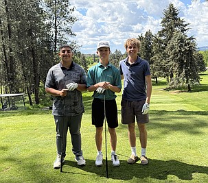 Warden’s Jaden Hernandez, Everett Cox and JJ Madsen stand together for a group photo ahead of their competition at the state golf tournament.