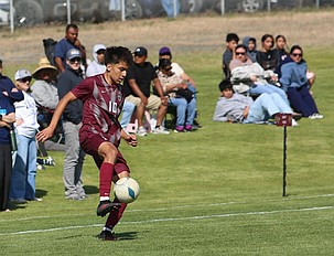 Ethan Moreno (10) taps the ball down during their state tournament game against Eastside Prep earlier this season. The Wahluke Warriors defeated Cascade and Fort Vancouver to advance to the 1A state soccer semifinals.