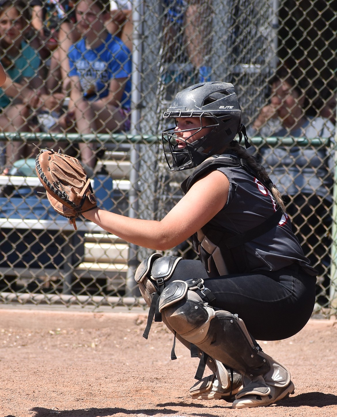 ACH sophomore Hannah Brummett gets ready as the catcher behind the opposing Colton batter Friday in the state tourney.