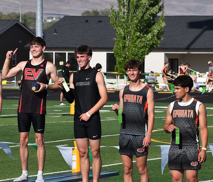 Jonah Hahn from Othello stands on the podium with Ephrata’s Maddax Iverson and Jacob Reyes after they all placed in the 110m hurdles.