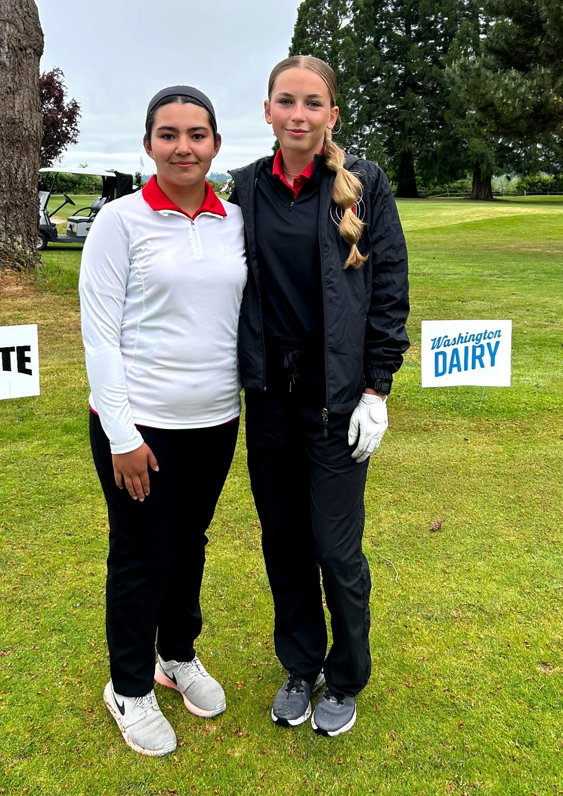 The Huskies’ Eileen Garza (left) and Autumn Weyns (right) take a group photo at the state tournament this season. Both players were named to the Central Washington Athletic Conference 2026 All-League first team.