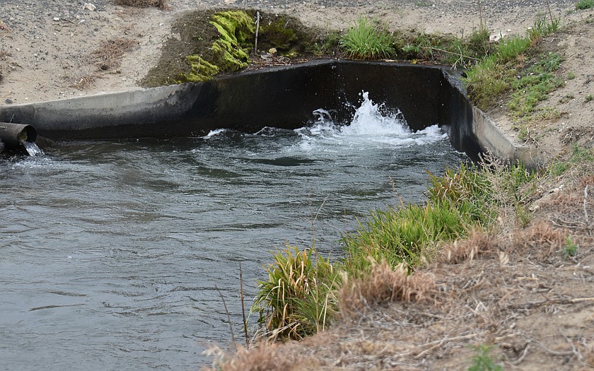 Water burbles through an irrigation canal near Royal City.