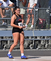 Saige Galbreath from the Lind-Ritzville Broncos gets ready to compete in the final round of shot put at the state meet.