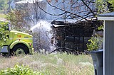 Wenatchee Road fire briefly threatens nearby buildings, but is contained