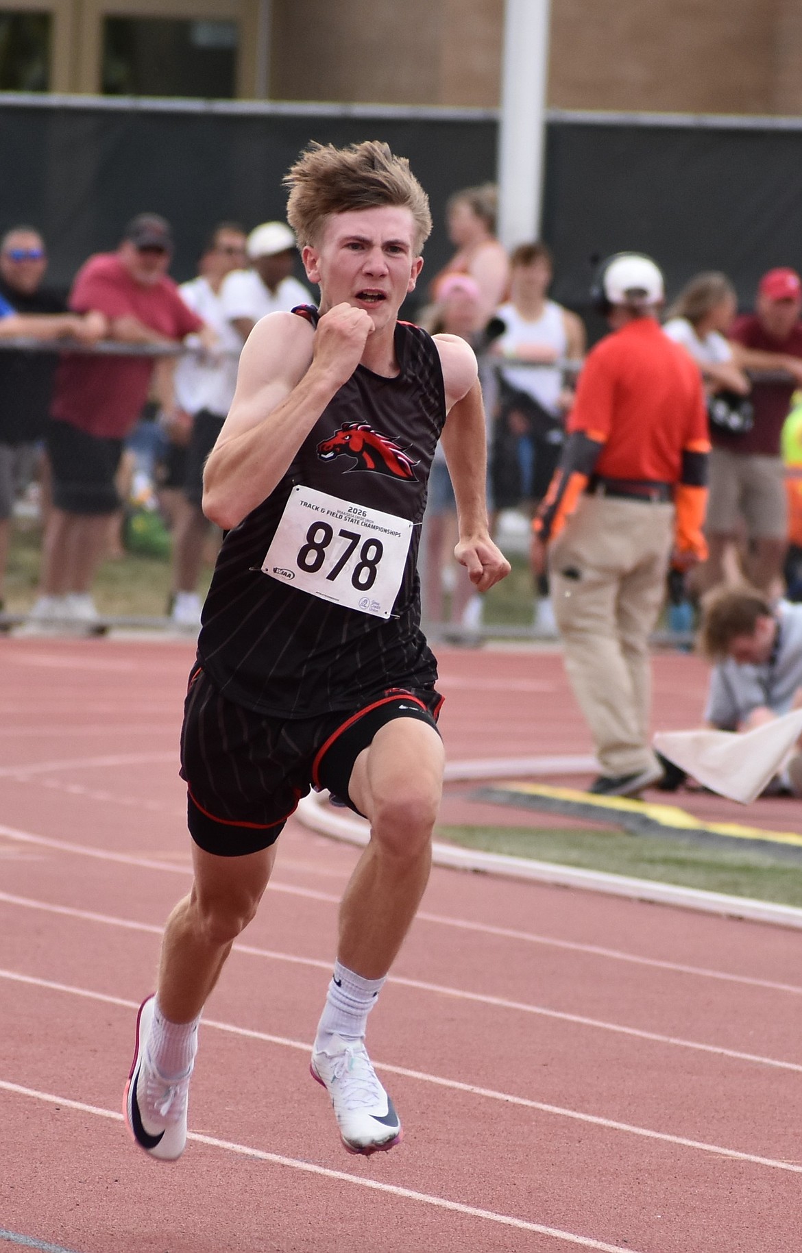 Damon Schilling, a senior from Lind-Ritzville, dashes toward the finish during the 100 meters.
