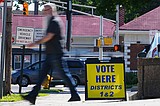 The Latest: Polls open for races across the US as a busy primary election day gets underway