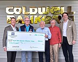 Coldwell Banker Schneidmiller Realty donates $50,000 for new veterans bus