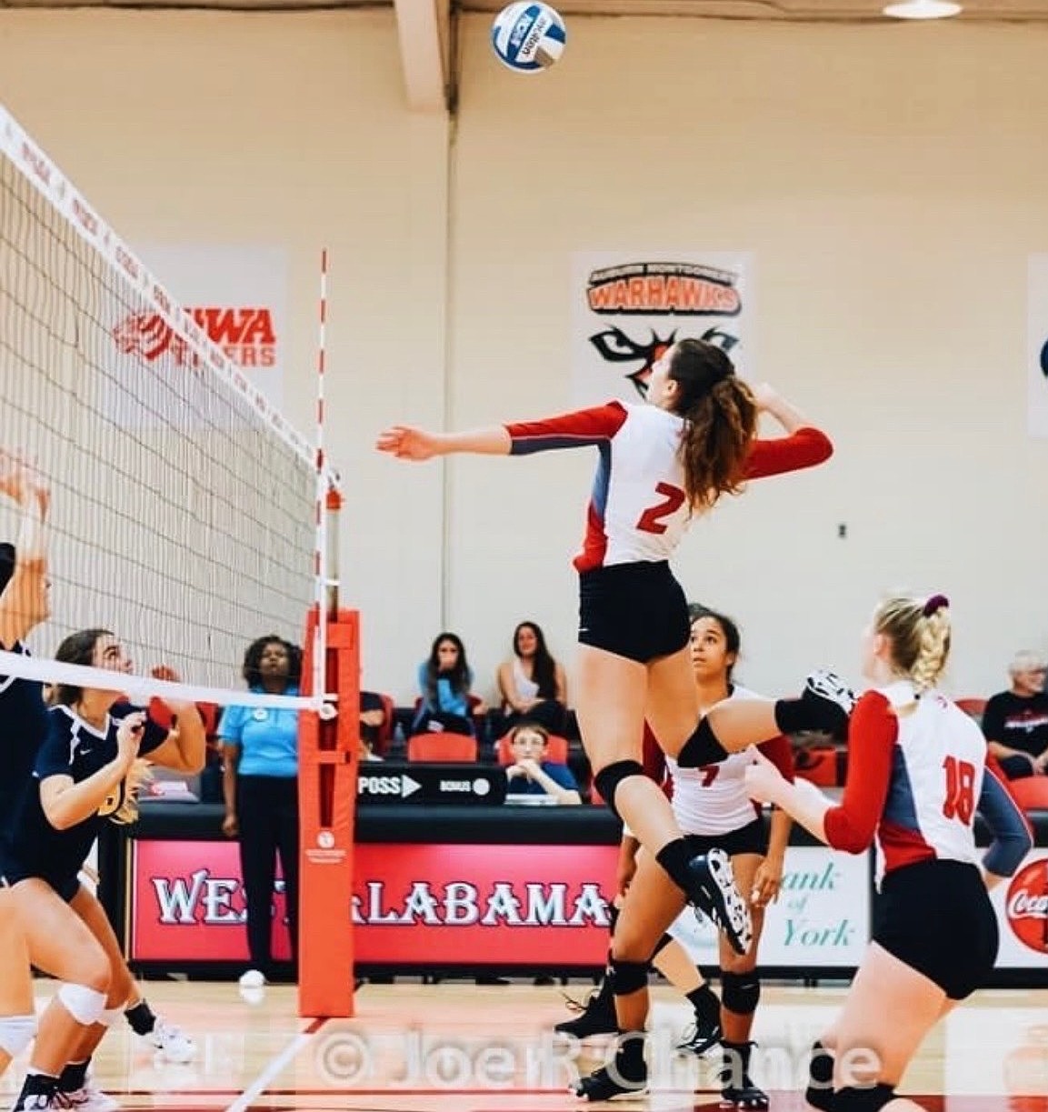 Jumping to spike the ball is McKaidan Boyd (2) while she played for the University of West Alabama. Boyd said her coaches in high school and in college helped shape her as a player and person.