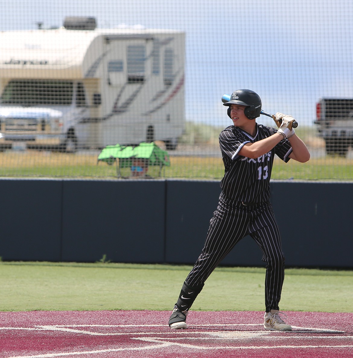 Carter Peone eyes the RCA Green pitcher while at bat during their game on Saturday.