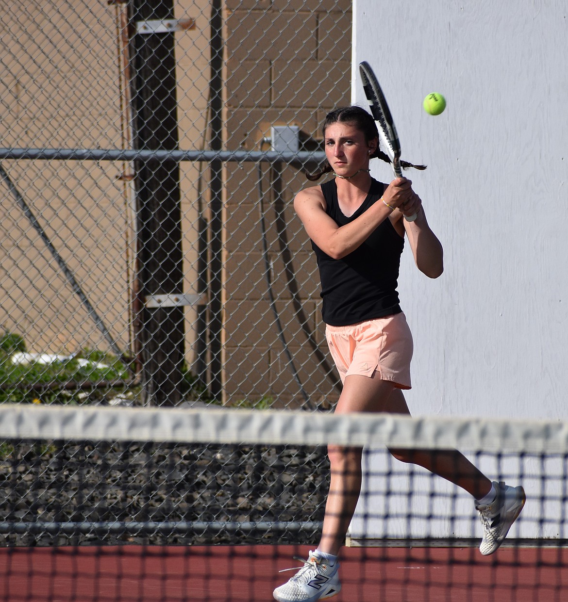 Olivia Harris, a senior with the Othello Huskies during the 2026 spring season, hits the ball back to her opponent in a mid-season home meet. Harris went on to qualify for the singles bracket at state.