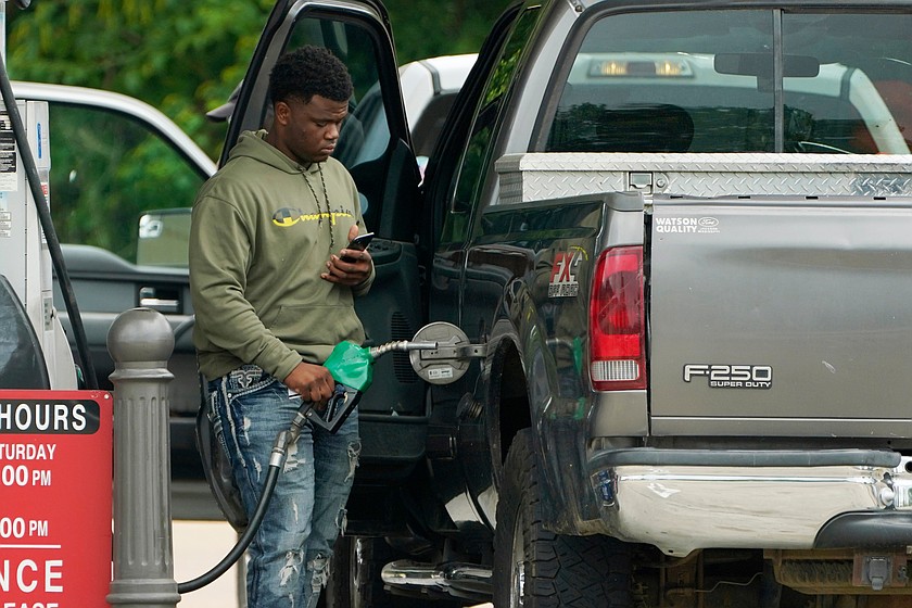 FILE - A customer prepares to pump diesel fuel at this Madison, Miss., Sam's Club, Tuesday, May 24, 2022. (AP Photo/Rogelio V. Solis, File)