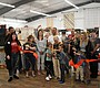 Country Fabrics owner Casey McDowall cuts the ribbon …