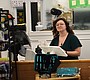 Amanda Miller stands behind the counter at Country …