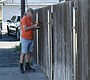 Jeff Pickens of Perryville, Arkansas repairs a fence …