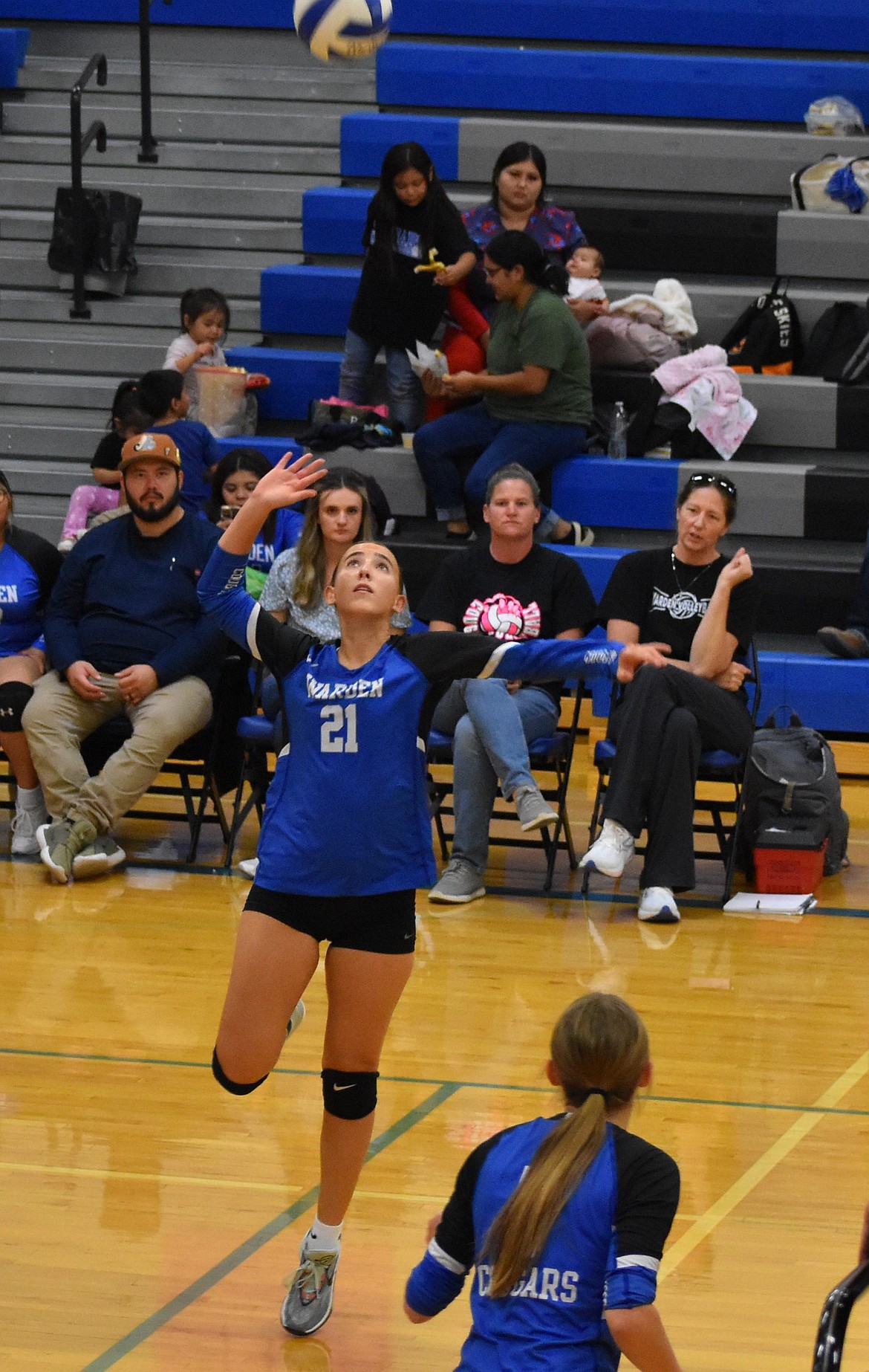 Warden’s Amaya Erickson leaps up to smack the volleyball back over the net during a home game in her senior year.