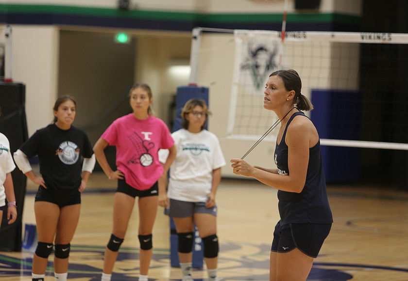 The Vikings’ Head Volleyball Coach Lindsey Linthicum (right) talks with attendees at last years summer camp. Her program will be hosting a day camp on June 26 for local Basin athletes.