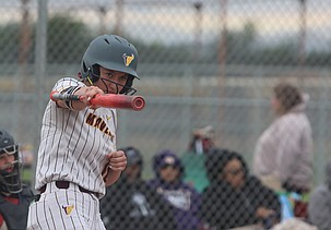 Amilia Borchert works through her swinging motion while at bat for the Moses Lake Mavericks earlier this season. Borchert will play college softball at St. Cloud University.