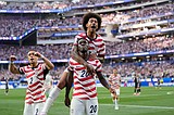 U.S. opens its home World Cup with a dynamic 4-1 victory over Paraguay, sparked by Balogun's 2 goals