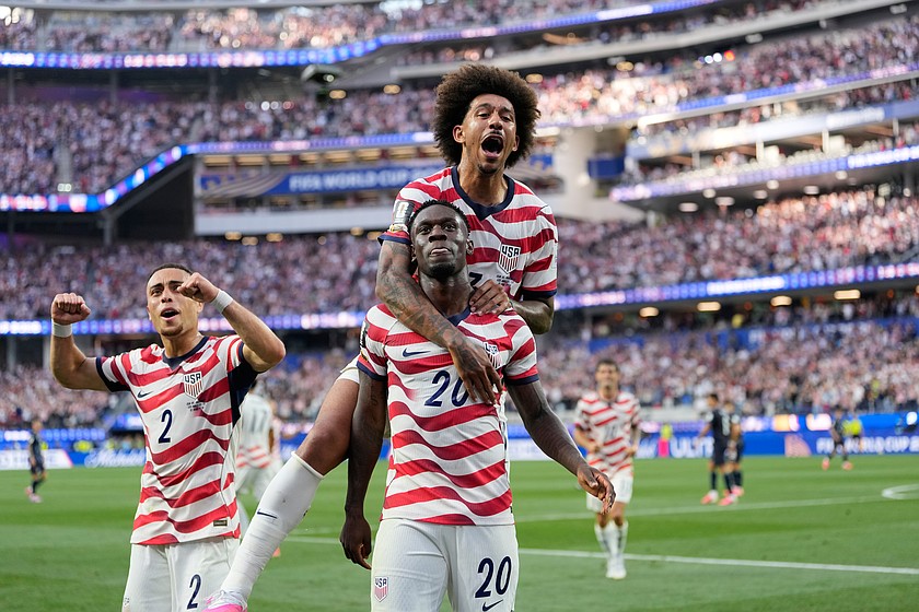 United States' Folarin Balogun (20) celebrates scoring his side's third goal against Paraguay with teammates during the World Cup Group D soccer match in Inglewood, Calif., near Los Angeles, Friday, June 12, 2026.