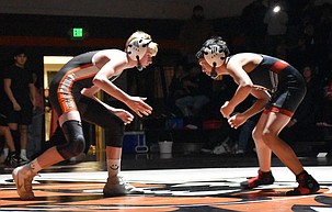 Ephrata wrestler Louden Leenhouts faces off against Othello’s Max Romero during the 2025/2026 winter wrestling season. The Tigers will be hosting a youth wrestling camp this summer.